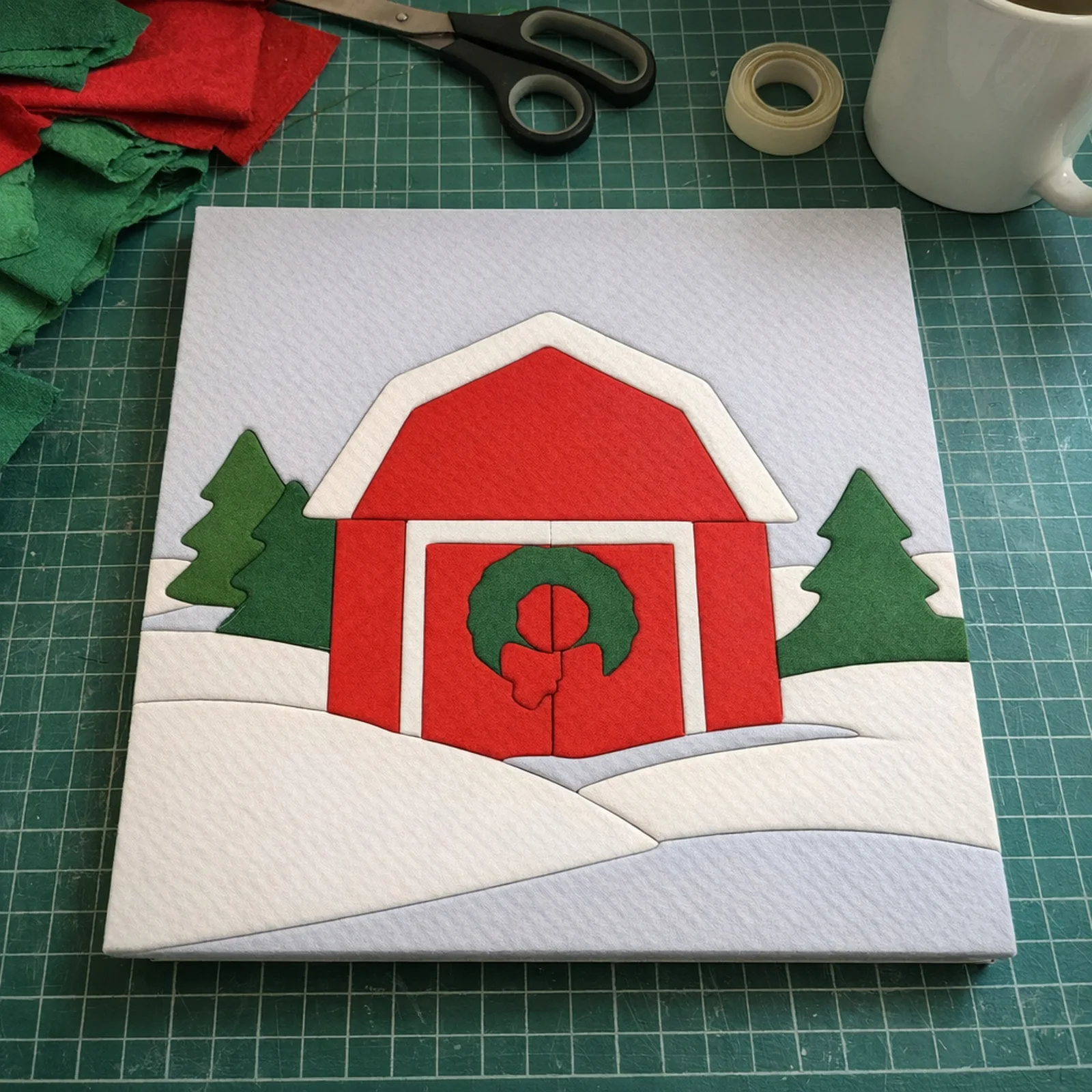 Red Barn in the Snow kinusaiga, just finished on a work table
